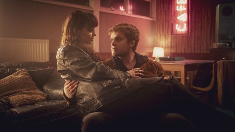 Amy sitting on Malachy's lap in BBC crime drama The Jetty