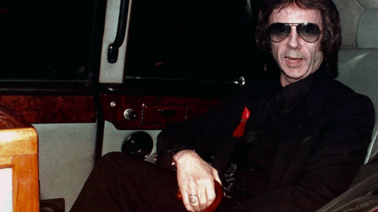 An image of Phil Spector in a limo.